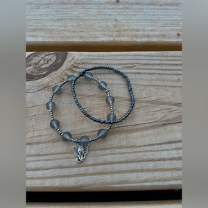 Two Elephant theme beaded bracelets,one with a charm. Same size and gray/silver.